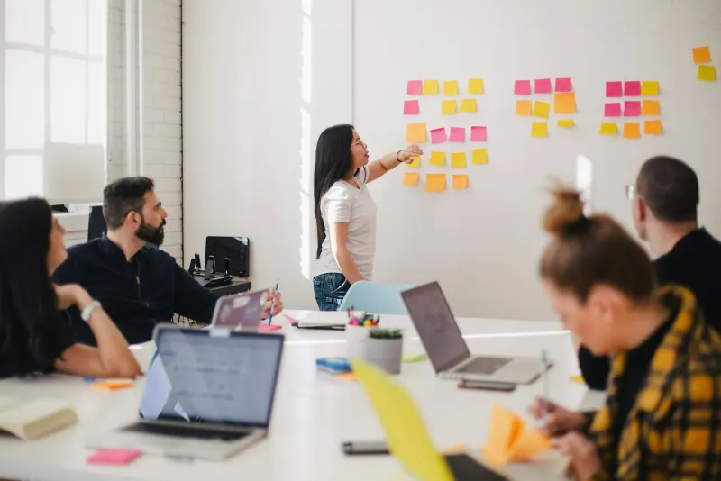 Business team discussing ideas around a conference table